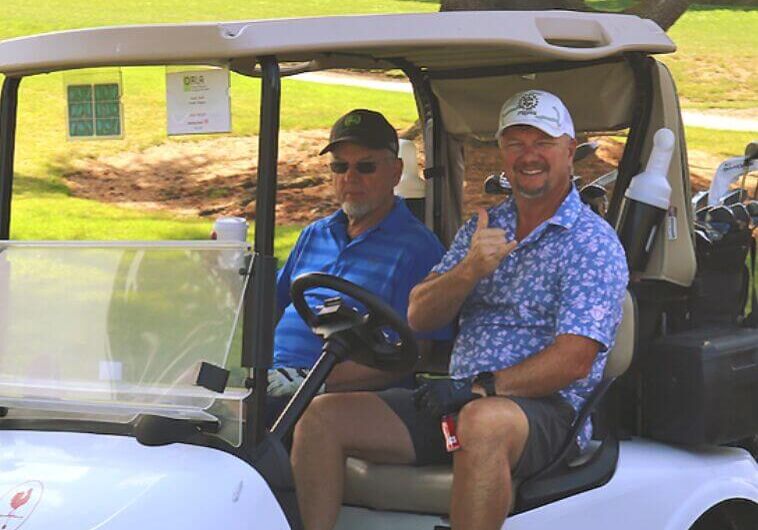 golfers in cart